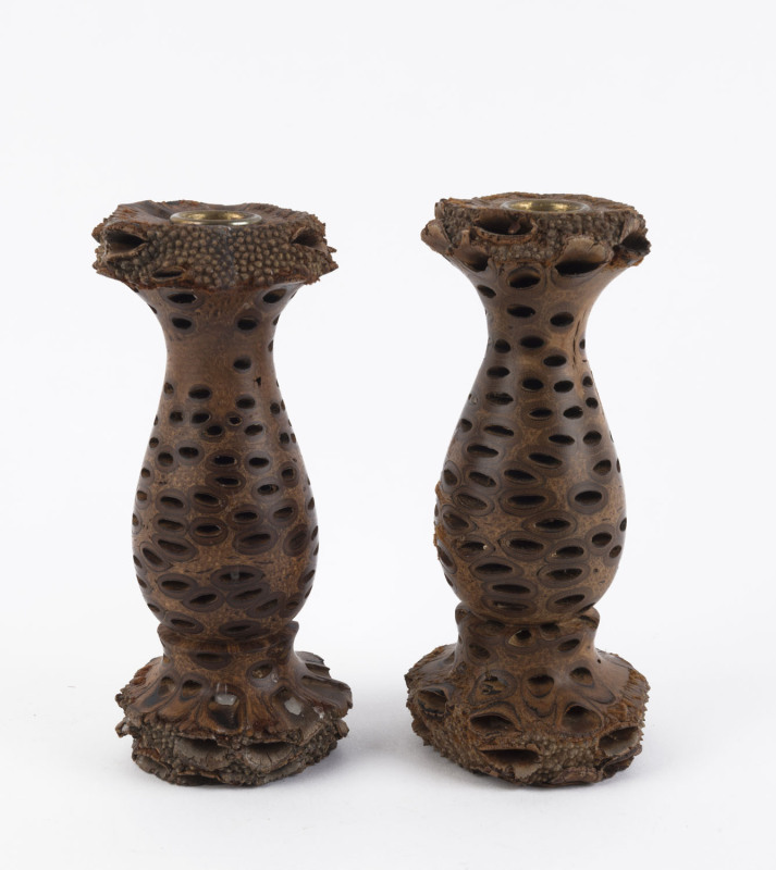 A pair of turned banksia candlesticks, 20th century, 19cm high