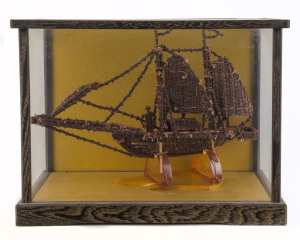 KAPAL AMBON model boat in cabinet, made from clove spices, with attached plaque "KAPAL AMBON, Trading boat of the Spice Islands (Moluccas) Made From Cloves. Presented by Dr. B. Faragher, Dr. B. Dunn", ​the cabinet 23cm high, 31cm wide, 17cm deep