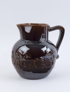 FOWLER "Harvest" jug with Rockingham glaze, circular factory mark to base. 21cm high, 21cm wide