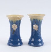 REMUED pair of blue glazed pottery vases, both with original foil labels, ​13cm high