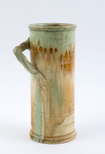 REMUED cylindrical pottery vase with branch handle, incised "Remued 145/9", 22.5cm high