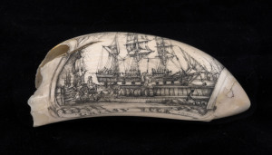 A scrimshaw whale's tooth titled "Greasy Luck" with tallship scene, signed Tonkin, 20th century, ​13cm long