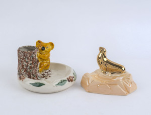 WEMBLEY WARE koala and seal ashtrays, (2 items), factory marks to bases, the larger 9.5cm high, 14cm wide
