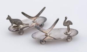 A pair of Australian silver plated knife rests adorned with boomerangs, kangaroo and emu, circa 1900, 10cm across