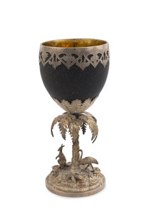WILLIAM EDWARDS Colonial silver mounted emu egg goblet, spectacularly adorned with kangaroo and emu amongst landscape and fern foliage, interior with original gilt wash finish, Melbourne, 19th century, stamped "W. E." with emu and kangaroo marks, 19.5cm high