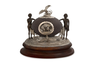 J. M. WENDT rare Australian silver mounted emu egg inkwell on timber plinth, adorned with Aboriginal figures, cockatoo finial and mirrored inset cartouche with kangaroo and emu in landscape decorated with fern fronds, South Australia origin, 19th century,