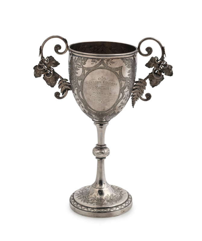 EDWARD FISCHER Colonial silver trophy cup adorned with ferns and grape leaves, engraved "Geelong College Sports, 1882 Hurdle Race, Mr G. Hope's Cup Won By E. Hope", stamped "E. Fischer, Geelong, Stg. Silver", 20.5cm high, 210 grams