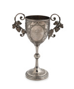 EDWARD FISCHER Colonial silver trophy cup adorned with ferns and grape leaves, engraved "Geelong College Sports, 1882 Hurdle Race, Mr G. Hope's Cup Won By E. Hope", stamped "E. Fischer, Geelong, Stg. Silver", 20.5cm high, 210 grams