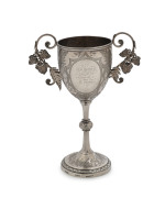 EDWARD FISCHER Colonial silver trophy cup adorned with ferns and grape leaves, engraved "Geelong College Sports, 1882 Hurdle Race, Mr G. Hope's Cup Won By E. Hope", stamped "E. Fischer, Geelong, Stg. Silver", 20.5cm high, 210 grams - 2