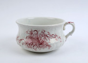 "NEW AUSTRALIAN FLOWERS" porcelain chamber pot, 19th century, stamped "New Australian Flowers, Stoke On Trent", 14cm high, 27cm wide