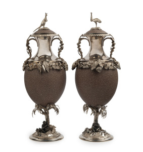 CHRISTIAN LUDWIG QVIST: A stunning pair of Australian silver mounted emu egg urns adorned with Aboriginal figures seated in strikingly natural poses with weapons and tools, kangaroos and an emu. A tour-de-force of Colonial silversmithing, museum quality. Stamped "C.L. QUIST, SYDNEY", 27cm high.
