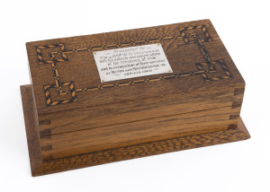 A presentation jewellery box, she-oak with barber pole inlay adorned with an Australian silver plaque "Presented By C.R. & Mrs W.D. VAUGHAN. With The Esteem And Appreciation Of The Citizens Of Kew And In Recognition Of their Services As Mayor And Mayoress