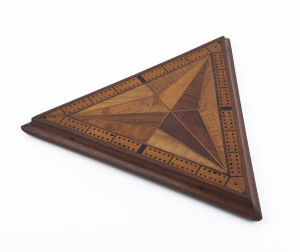 A triangular cribbage board made from assorted Australian timbers, late 19th century, ​41cm wide