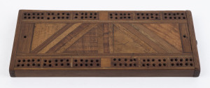 An antique cribbage board made by ALLAN DUCKWORTH with label verso listing 14 "Australian Ornamental Timbers", 19th century, ​22cm wide