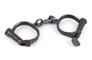 FIELD & SONS antique handcuffs, iron with remains of original nickel plated finish, with key, mid 19th century, stamped "Field & Sons London", 23cm wide