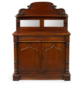 A Colonial Australian cedar chiffoniere with shield doors and mirrored panels, circa 1965,