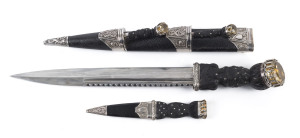 A fine Scottish dirk with carved ebony handles set with impressive citrines, in original plush fitted leather case. Formerly the property of George Gibb the brother of Rev. James Gibb (1857–1935). 50cm long