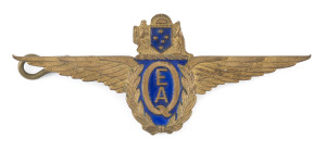 QANTAS EMPIRE AIRWAYS pilot badge, gilt wings with blue enamel, made by Angus & Coote, circa 1935, 8cm long.