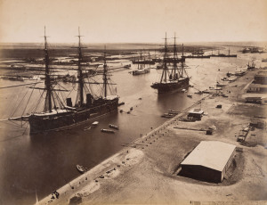 A group of albumen prints, circa 1880s, mounted on pages removed from an old-time album. The images include South Africa, Malaya, Suez Canal views, a scene at the boating clubhouse Richmond (England), Port Said, etc. Mostly 21 x 27.5cm. (16 items).