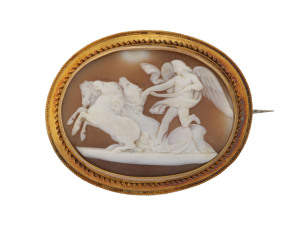 A fine and large antique oval cameo brooch mounted in yellow gold showing Helios with his team of horses, 19th century, ​6cm wide