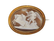 A fine and large antique oval cameo brooch mounted in yellow gold showing Helios with his team of horses, 19th century, ​6cm wide