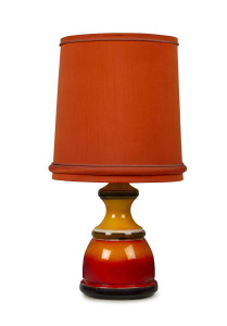 An Australian orange and red pottery table lamp with original orange shade, mid 20th century, 84cm high overall