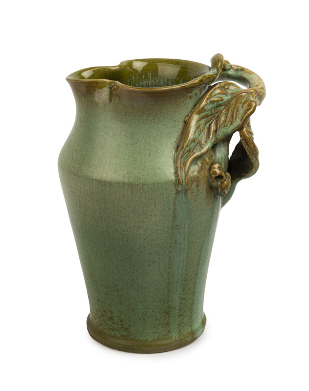 REMUED green glazed pottery jug with applied gumnuts and leaves with branch handle, incised "Remued Hand Made 54/8M", ​23cm high, 17cm wide