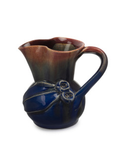 REMUED pink and blue glazed pottery jug with applied gumnuts and leaf with branch handle, incised "Remued Hand Made 118 M", 11.5cm high, 12.5cm wide