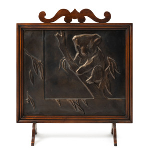 A koala fire screen, embossed brass and blackwood, early 20th century, 80 x 71cm high. PROVENANCE: The Marvin Hurnall Collection