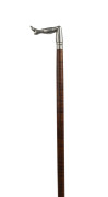 An Australian walking stick, fiddleback blackwood shaft with cast metal leg handle engraved "J. JAMES COLRAINE", late 19th century, missing ferrule, ​85cm high