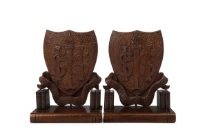 SCOTTSDALE HIGH SCHOOL pair of book ends, carved blackwood, circa 1920, ​20cm high