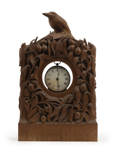 JOHN KENDRICK BLOGG (attributed) clock case profusely carved with gumnuts and leaves with butcherbird perched on top, early 20th century, 47cm high