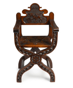 An Australian Savonarola chair, kauri pine with carved griffin and monogram "M.J.G." for MARTIN J. GRIFFIN, former Mayor of Bathurst N.S.W. 1931-1941, 107cm high, 58cm wide, 53cm deep