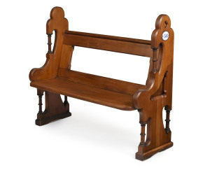 An antique Gothic style church pew, kauri pine with enamelled number plaque, 19th century, 106 cm high, 122cm wide, 50cm deep