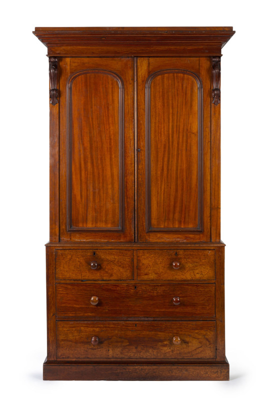 A Colonial Australian cedar gentleman's wardrobe, four drawer base with hanging top, 19th century, 235cm high. 131cm wide, 63cm deep