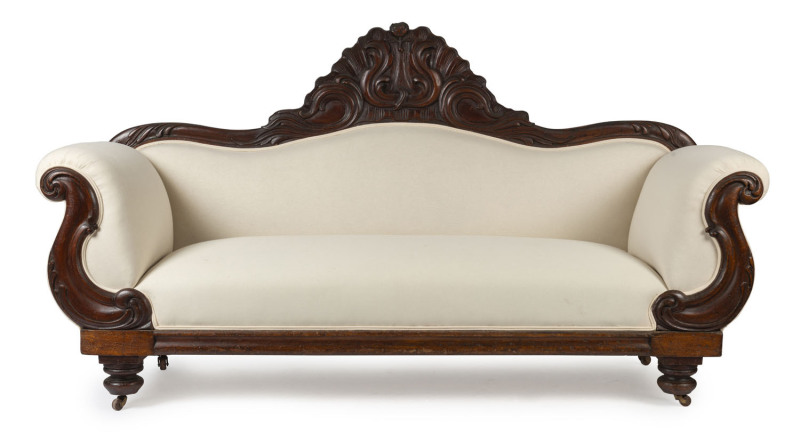 A Colonial cedar settee with ornately carved high back, South Australian origin, circa 1860, ​121cm high, 230cm wide, 70cm deep