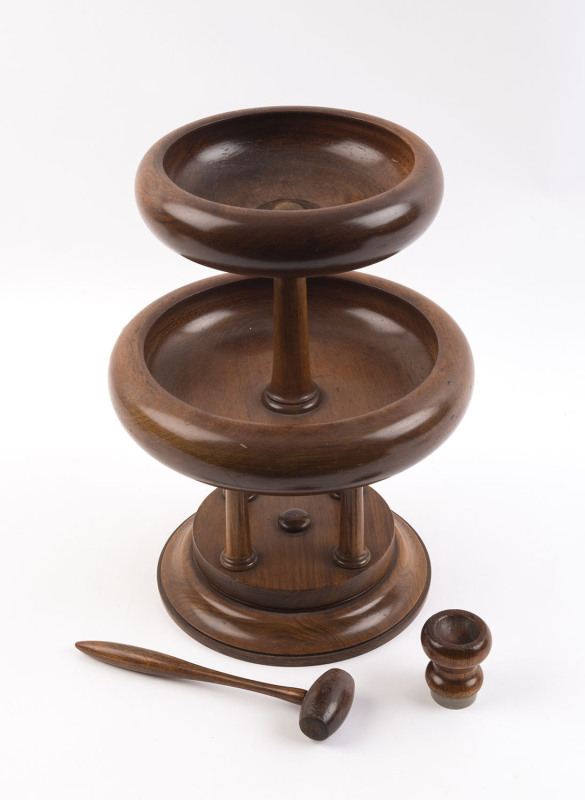 An antique Australian revolving centre piece with nutcracker top, turned blackwood, 19th century, 40cm high, 30cm diameter