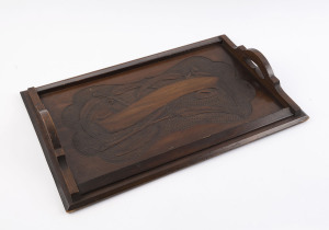 An Australian timber tray, kauri pine carved with gumnuts and leaves, circa 1900, 55cm across the handles