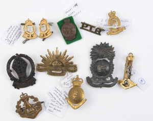 Various Australian badges including Pacific Island Regiment (2 types), the Royal Regiment, Royal Australian Signals (2-part hat badge), Royal Australian Survey Corps, Australian Garrison Artillery, Australian Cadet Corps (Camberwell Grammar), Royal Austra