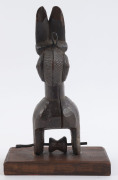 Two African weaving pulleys, carved wood, Baule tribe, Ivory Coast, on later wooden plinths, 18cm and 23cm high overall - 10