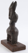 Two African weaving pulleys, carved wood, Baule tribe, Ivory Coast, on later wooden plinths, 18cm and 23cm high overall - 11