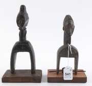 Two African weaving pulleys one with original spool, carved wood, Baule tribe, Ivory Coast, on later wooden plinths, 21cm and 24.5cm high overall - 2