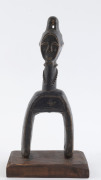 Two African weaving pulleys one with original spool, carved wood, Baule tribe, Ivory Coast, on later wooden plinths, 21cm and 24.5cm high overall - 3