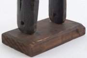 Two African weaving pulleys one with original spool, carved wood, Baule tribe, Ivory Coast, on later wooden plinths, 21cm and 24.5cm high overall - 8