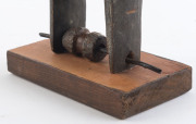 Two African weaving pulleys one with original spool, carved wood, Baule tribe, Ivory Coast, on later wooden plinths, 21cm and 24.5cm high overall - 11