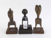Three African weaving pulleys, carved wood, Baule tribe, Ivory Coast, on later wooden plinths, 17cm, 18cm and 20cm high overall - 2