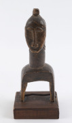 Three African weaving pulleys, carved wood, Baule tribe, Ivory Coast, on later wooden plinths, 17cm, 18cm and 20cm high overall - 3