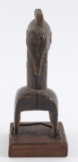 Three African weaving pulleys, carved wood, Baule tribe, Ivory Coast, on later wooden plinths, 17cm, 18cm and 20cm high overall - 5