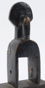 Three African weaving pulleys, carved wood, Baule tribe, Ivory Coast, on later wooden plinths, 17cm, 18cm and 20cm high overall - 10