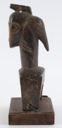 Three African weaving pulleys, carved wood, Baule tribe, Ivory Coast, on later wooden plinths, 17cm, 18cm and 20cm high overall - 14